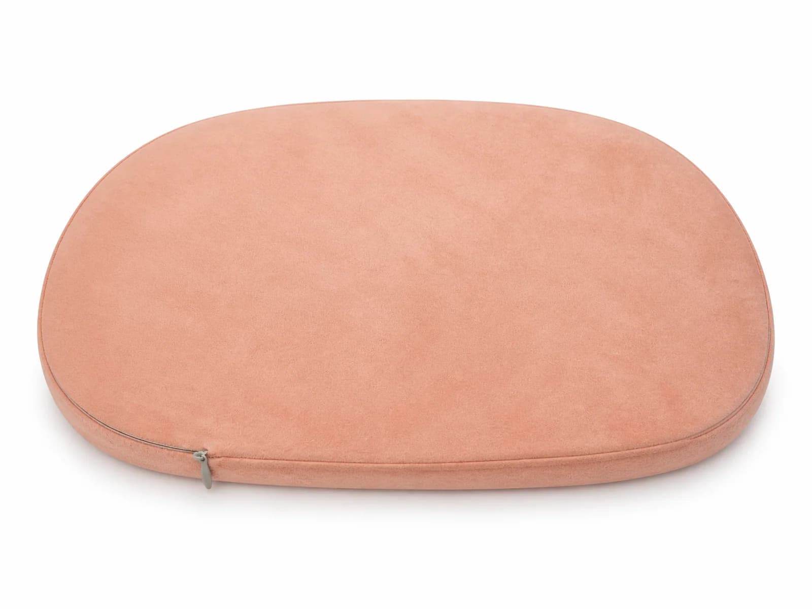 Underside view of the pillow showing hidden zipper seam and removable washable fabric cover