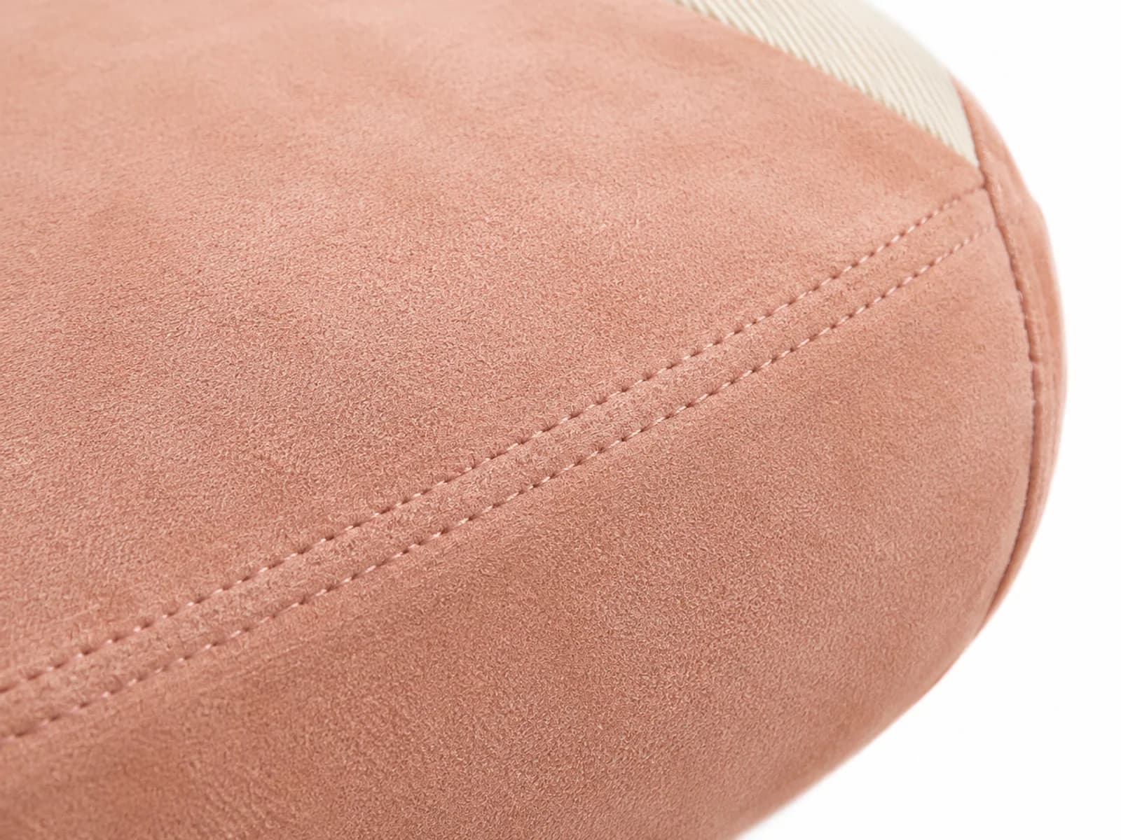 Detailed craftsmanship view of premium soft-touch suede upholstery with double-stitched reinforced borders
